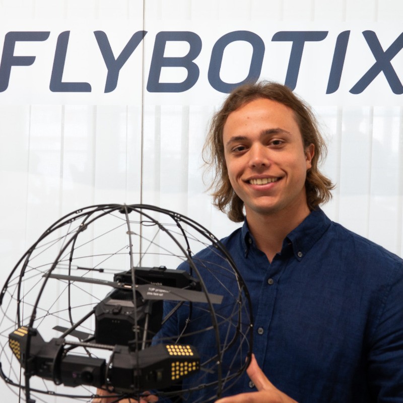 Flybotix employeee, Alejandro Quidiello holding ASIO Pro drone